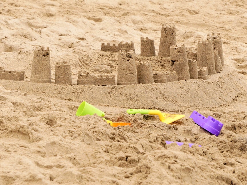 sandcastle on sunny day during family vacation